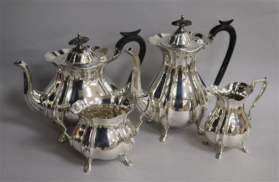 A 1920s silver four piece tea set by Walker & Hall, gross 61 oz.